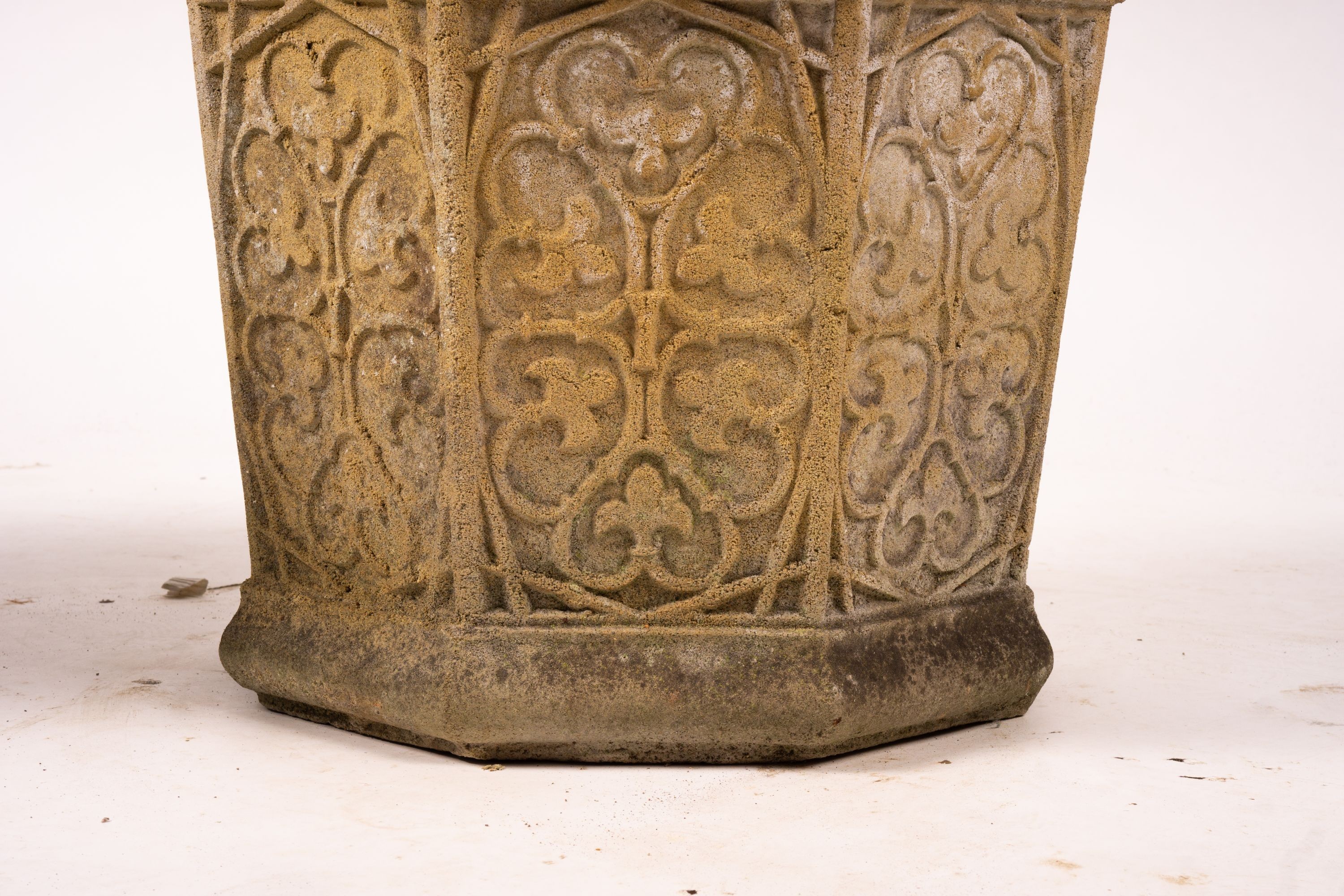 A pair of octagonal reconstituted stone garden planters, width 48cm, height 42cm